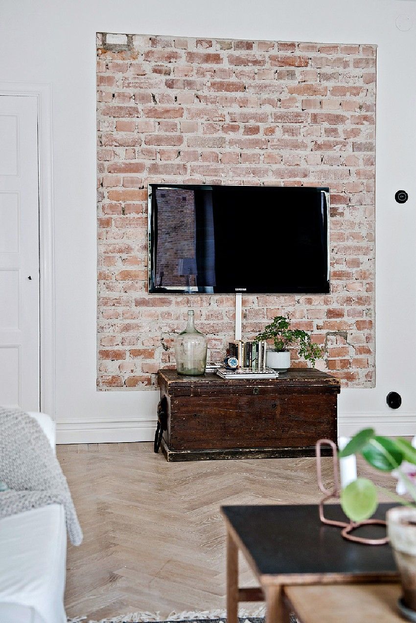 one-room-Scandinavian-apartment-brick-TV-wall
